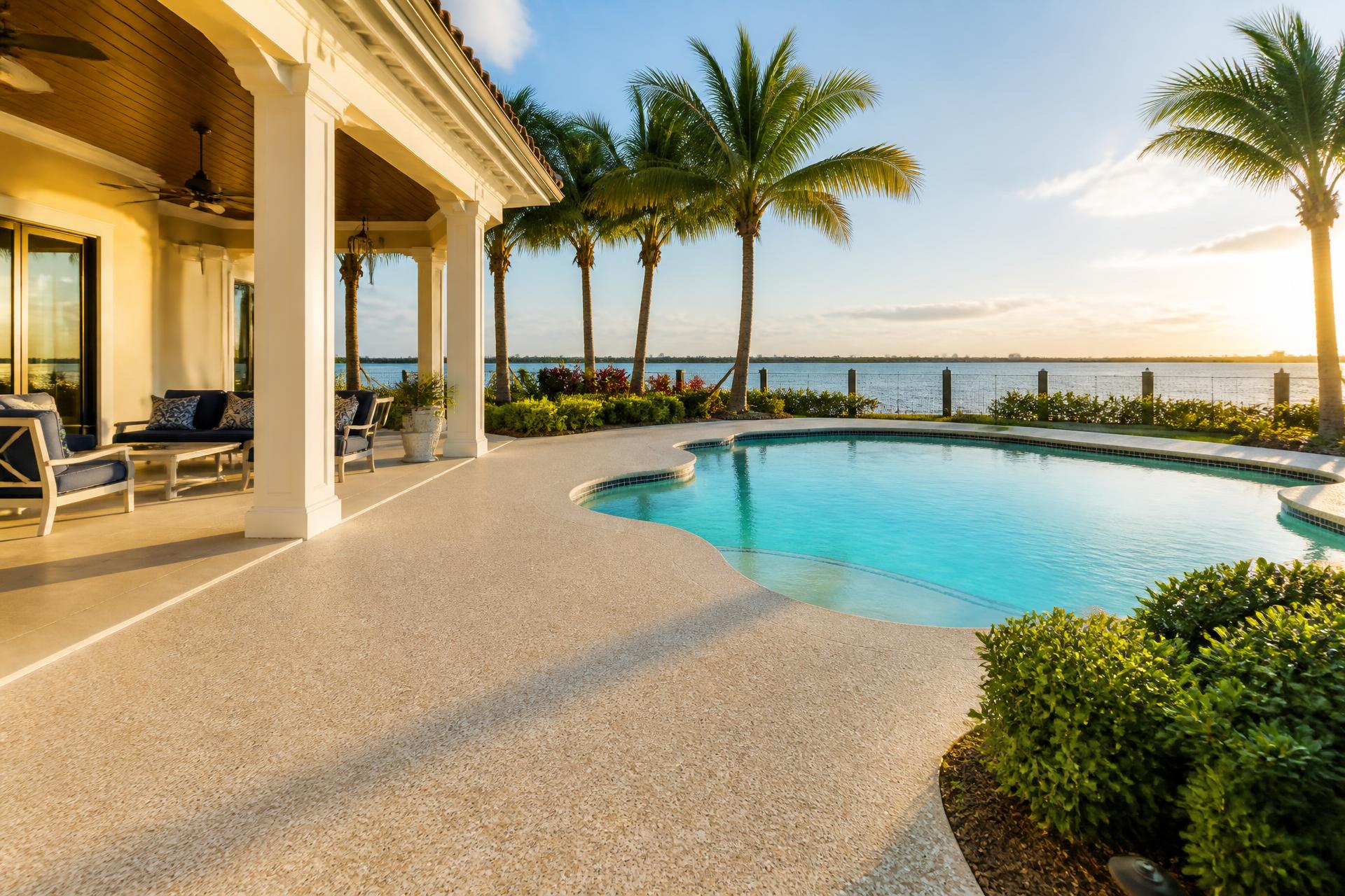 Freshly coated coastal pool deck at golden hour in Gulf Breeze, Florida